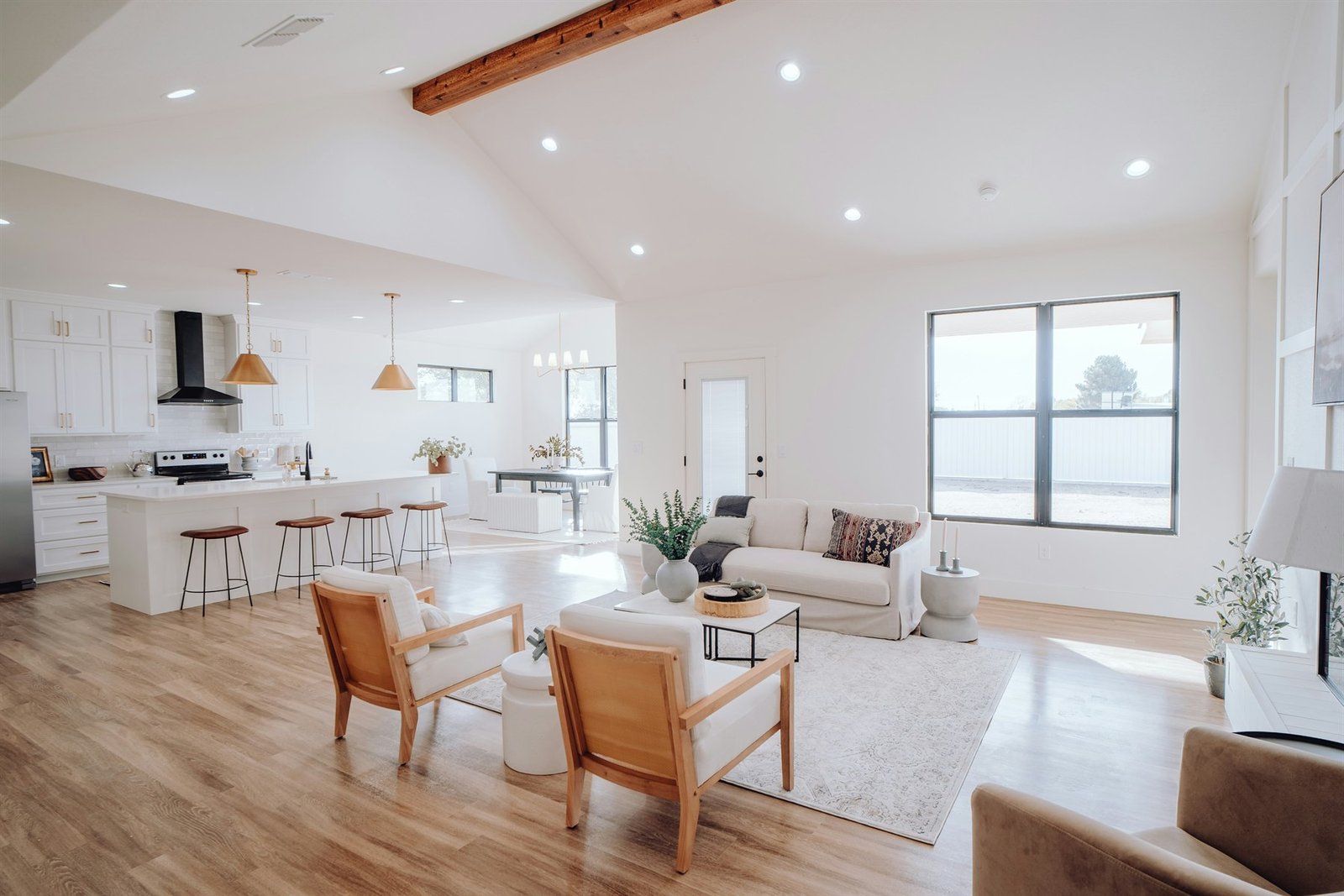 Bright open-plan kitchen and living room with a vaulted ceiling