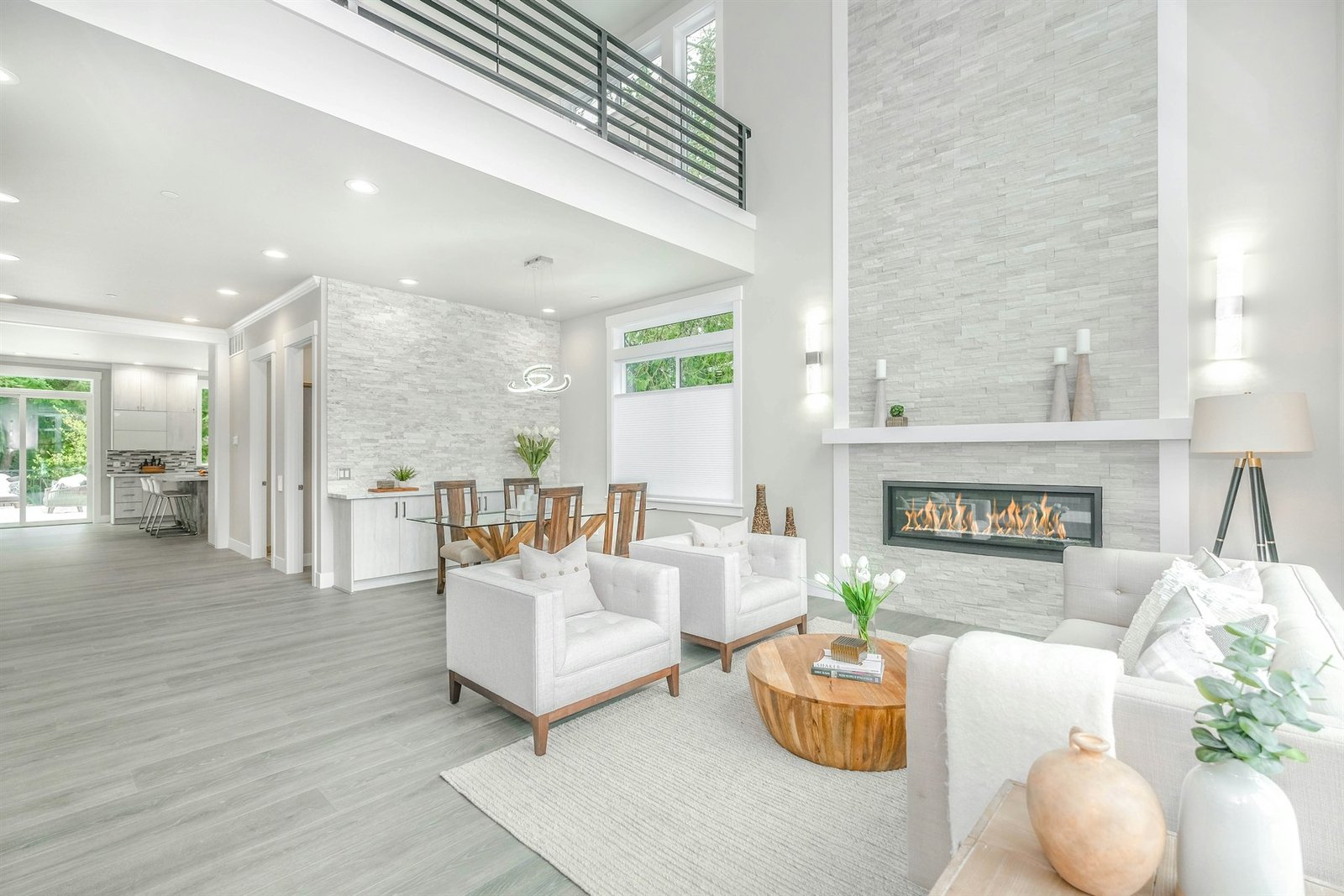Bright contemporary living room with a stone fireplace